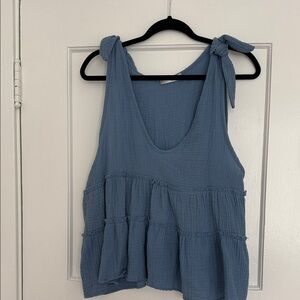 Blue sleeveless top with bow detailing